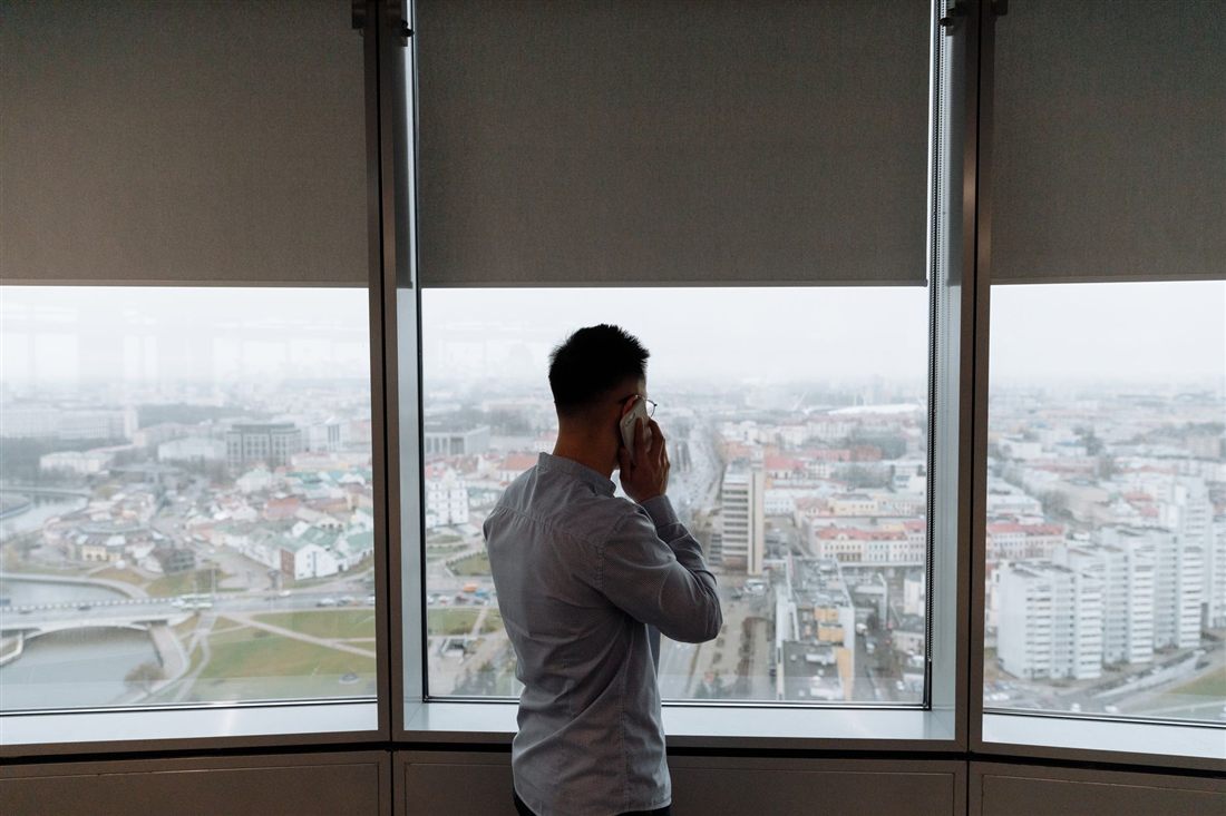 A professional at a window considering a settlement offer